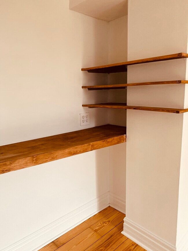 custom rehabbed wood shelves in second floor front room - 813 S 17th St