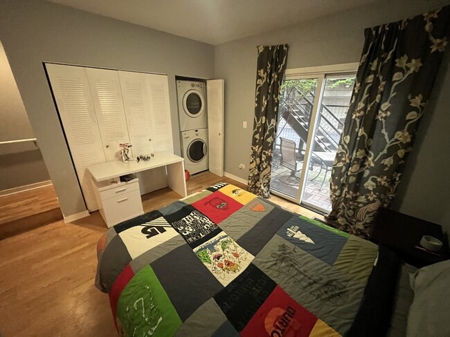 First floor bedroom with outside living space with small fenced year - 1713 W Diversey Pky