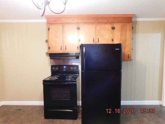 Building Photo - Home with 2 bedrooms, 1 bath, side deck, carport with side porch and detached garage