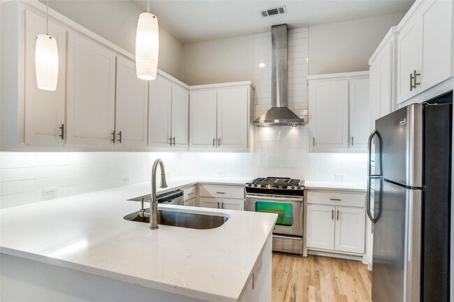 Building Photo - Beautiful townhome featuring granite countertops, hard wood floors, and a small private yard grea...