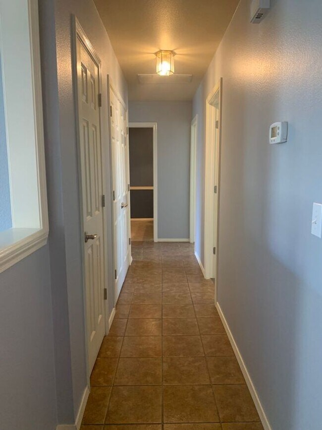 Building Photo - This beautifully updated three-bedroom, tw...