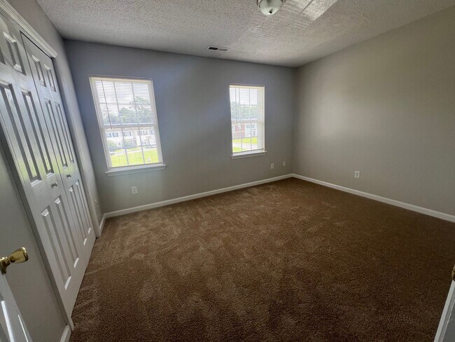 Building Photo - This property features 2 bedrooms and 2.5 bathrooms. Conveniently located near shopping centers, ...