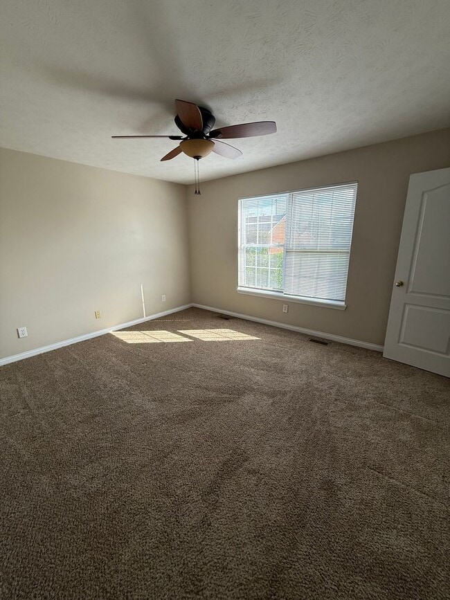 Building Photo - 2-bedroom, 1.5-bath townhouse with an attached garage