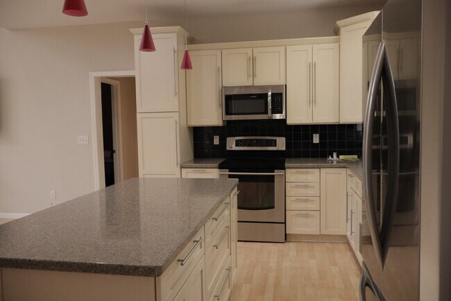 Building Photo - Expansive Mostly-Furnished Residence featuring 3 Bedrooms, a Completed Basement, and a Loft Space