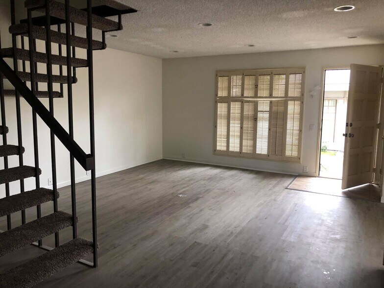 Living room; Stairs to the left, entrance to the right - 9594 Easter Way