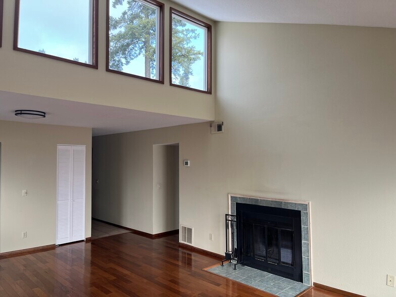 Pop-up windows in living room with partial view of fireplace - 7511 N Edgewater Ave