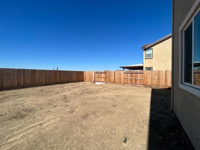 Building Photo - Spacious 4-Bedroom Retreat with 2.5 Baths in Los Banos – Your Ideal Family Home Awaits in a gated...