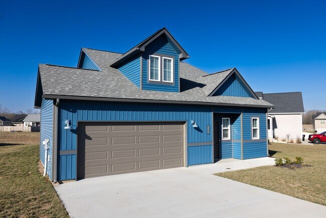 Building Photo - Elegant Home with Stone Fireplace, Kitchen Island and Designer Primary Suite