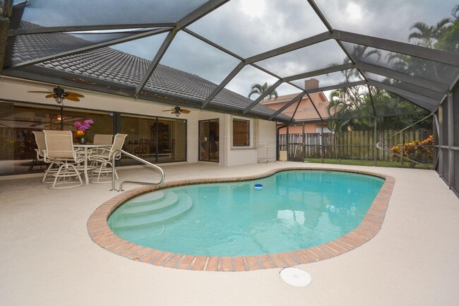 Screened covered patio and pool - 4355 NW 25th Way