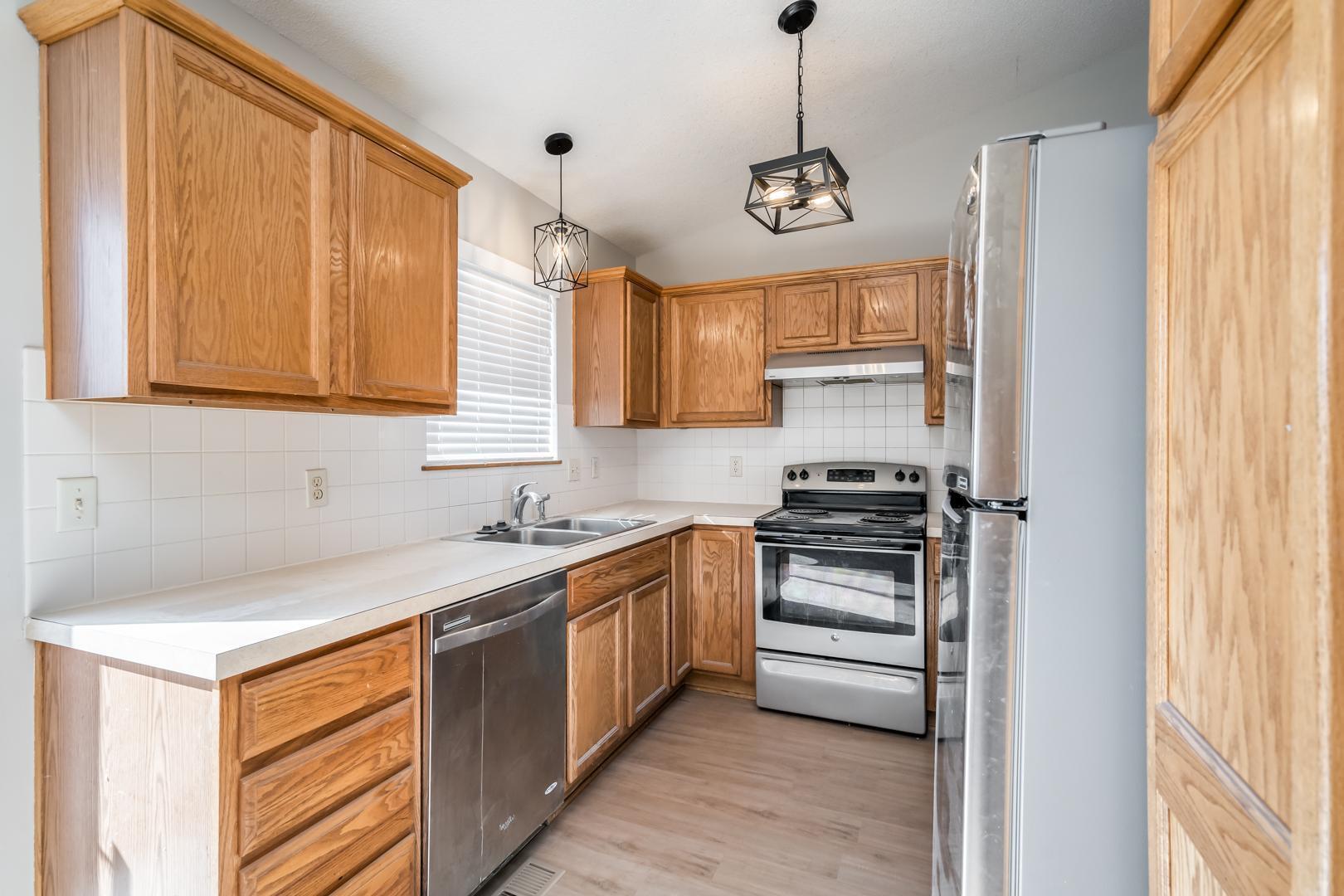 Kitchen with Stainless Steel Appliances - 6317 Quail Ridge St