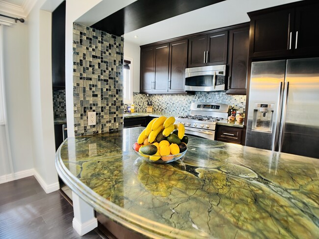 Tile accents in kitchen. - 6301 Coldwater Canyon Ave