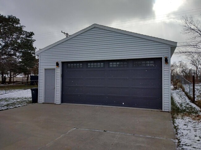 Two stall garage with storage and tool bench - 1111 Clifton St NE