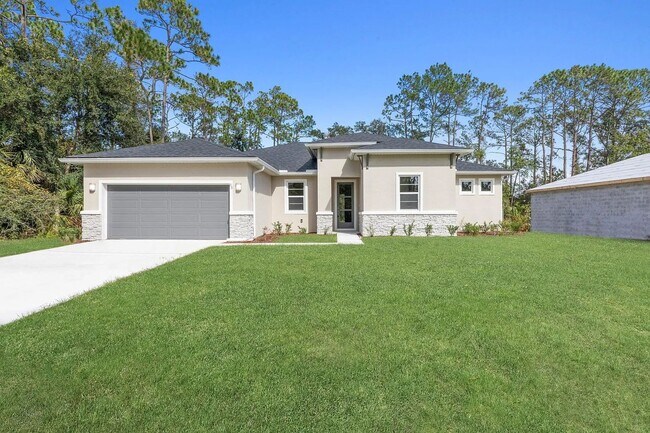 Building Photo - Spacious 4-Bedroom Rental in Palm Coast with Ultimate Privacy