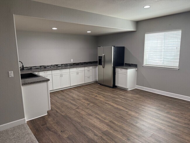Building Photo - Greenbelt-Backed Wheatlands Home - Mountain Views, 3 Car Garage & Finished Basement