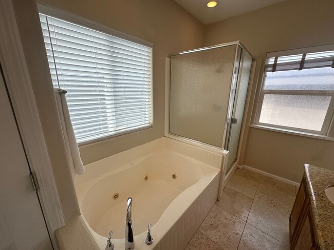 Building Photo - Move in special: $500 off first months rent! Home located in a gated Lakefront community with 3 s...