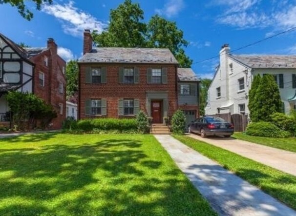 exterior with driveway and attached garage - 2825 Northampton St NW