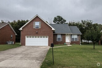 Building Photo - Pet Friendly Three Bedroom with Bonus!