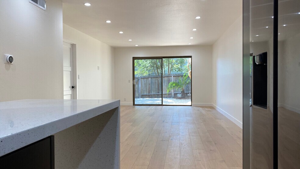 Living Room facing light filled Patio - 6474 Cavalleri Rd
