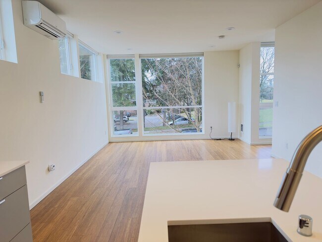 Building Photo - 3 Bedroom Central District Townhome w/ Garage, AC & Rooftop Deck