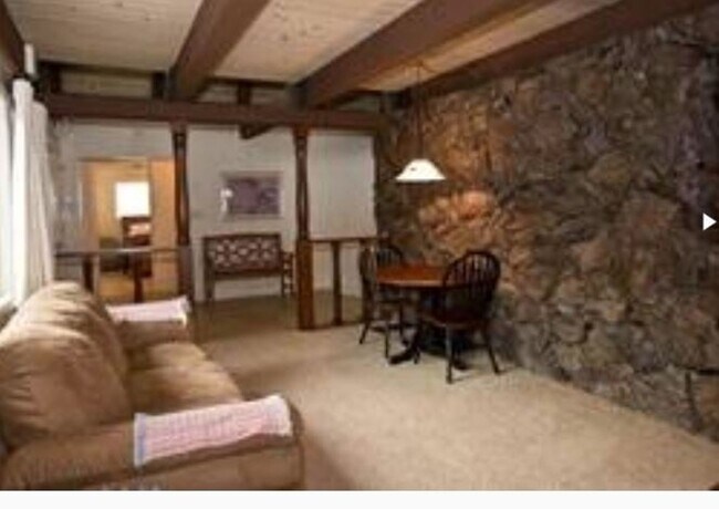Building Photo - Unique open design,wood beams in all rooms-Very cheery and cozy. Newly remodeled, and newly furni...
