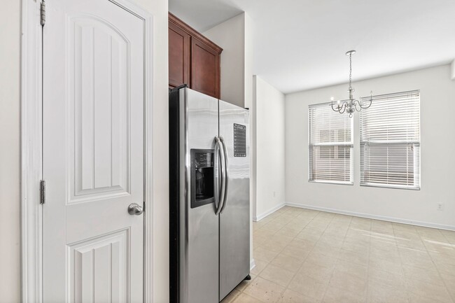 Building Photo - Spacious 4-Bedroom End-Unit Townhome in a ...