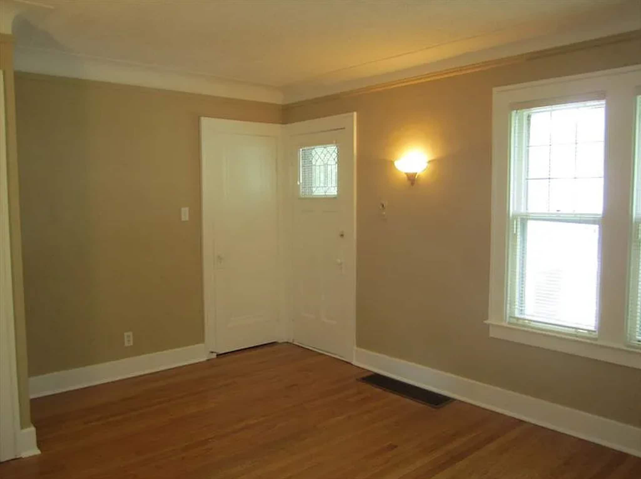 Living room closet and door to front balcony - 164 Jewell St