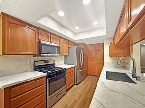 Building Photo - Great 2 bed/2bath condo w/AC, detached garage, and solar!