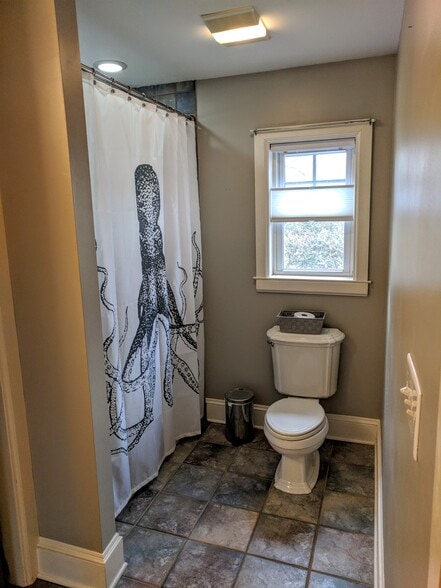Primary bathroom (not attached, but directly across from the primary bedroom) - 1627 Nassau Blvd