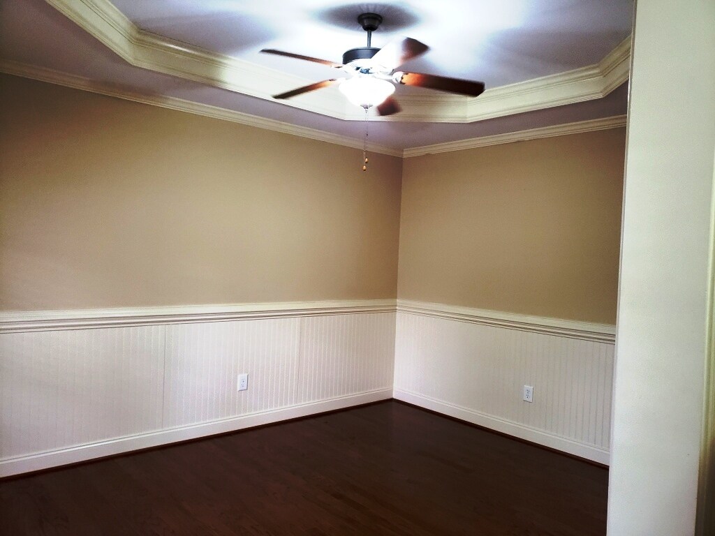formal dining with wainscotting - 120 Thistle Top Trl