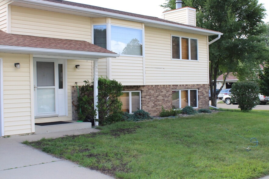 front of house, reseeding areas currently - 3991 Whiting Ln NE