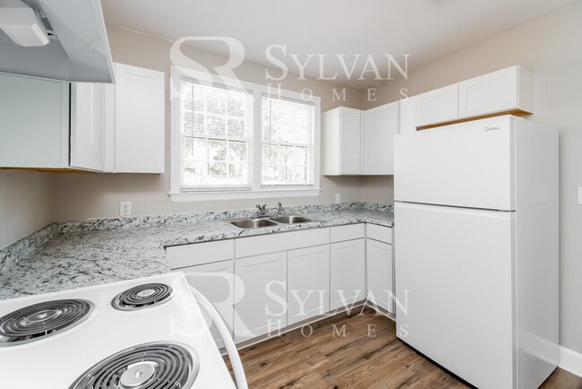 Building Photo - The living is easy in this 3 bedroom, 2 bathroom brick home