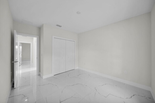Building Photo - Brand-New Home in Lehigh Acres – Move-In Ready! FL 33974. Qualify for a deposit-free option and s...