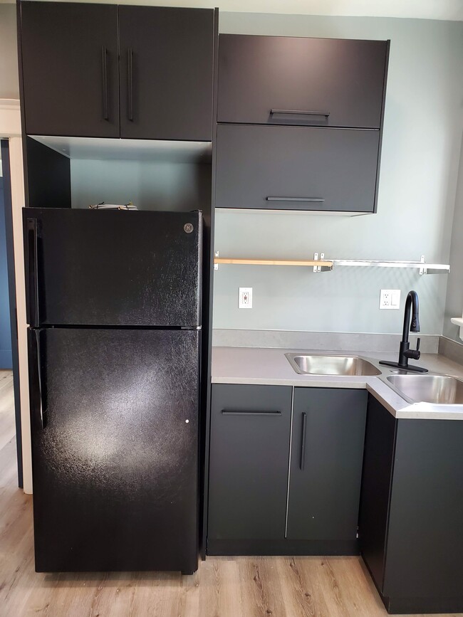 Brand new GE refrigerator w/ice maker; double sink with garbage disposal - 579 W. 13th St