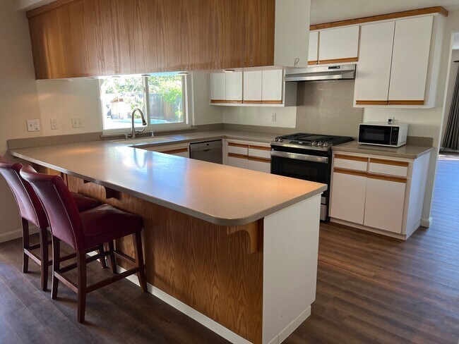 Building Photo - Four bedroom two bathroom home with a pool in Central Davis