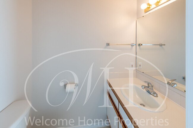 Building Photo - Enjoy the Open Floor Plan and Generous Storage in this College Place Duplex