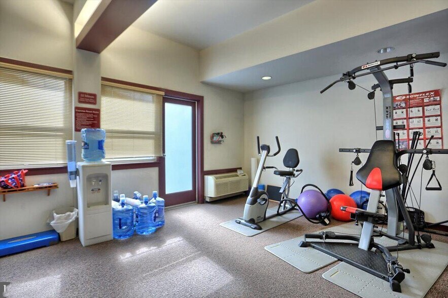 Fitness Room with Door to Balcony Overlooking Interior Courtyard - 133 W Locust St