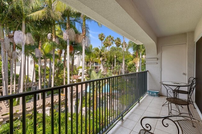 Building Photo - RARELY offered! Top floor three bedroom 2.5 bath El Escorial condo, fully furnished at East Beach.