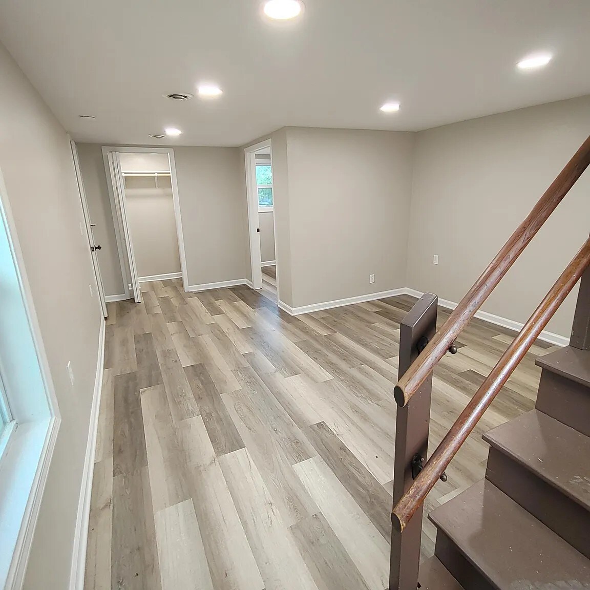 Large bedroom downstairs can fit a king bed, with closet and ensuite half-bath - 96 Ponder St