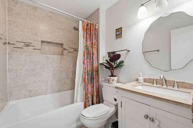 Building Photo - This beautifully refreshed condominium offers a refined blend of style and comfort