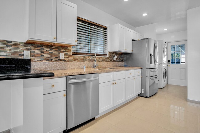 Building Photo - Stunning Remodeled Corner-Lot Home – An En...