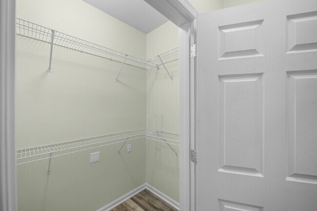 Building Photo - Two-bedroom, two-bathroom model with a den, located on the third floor.
