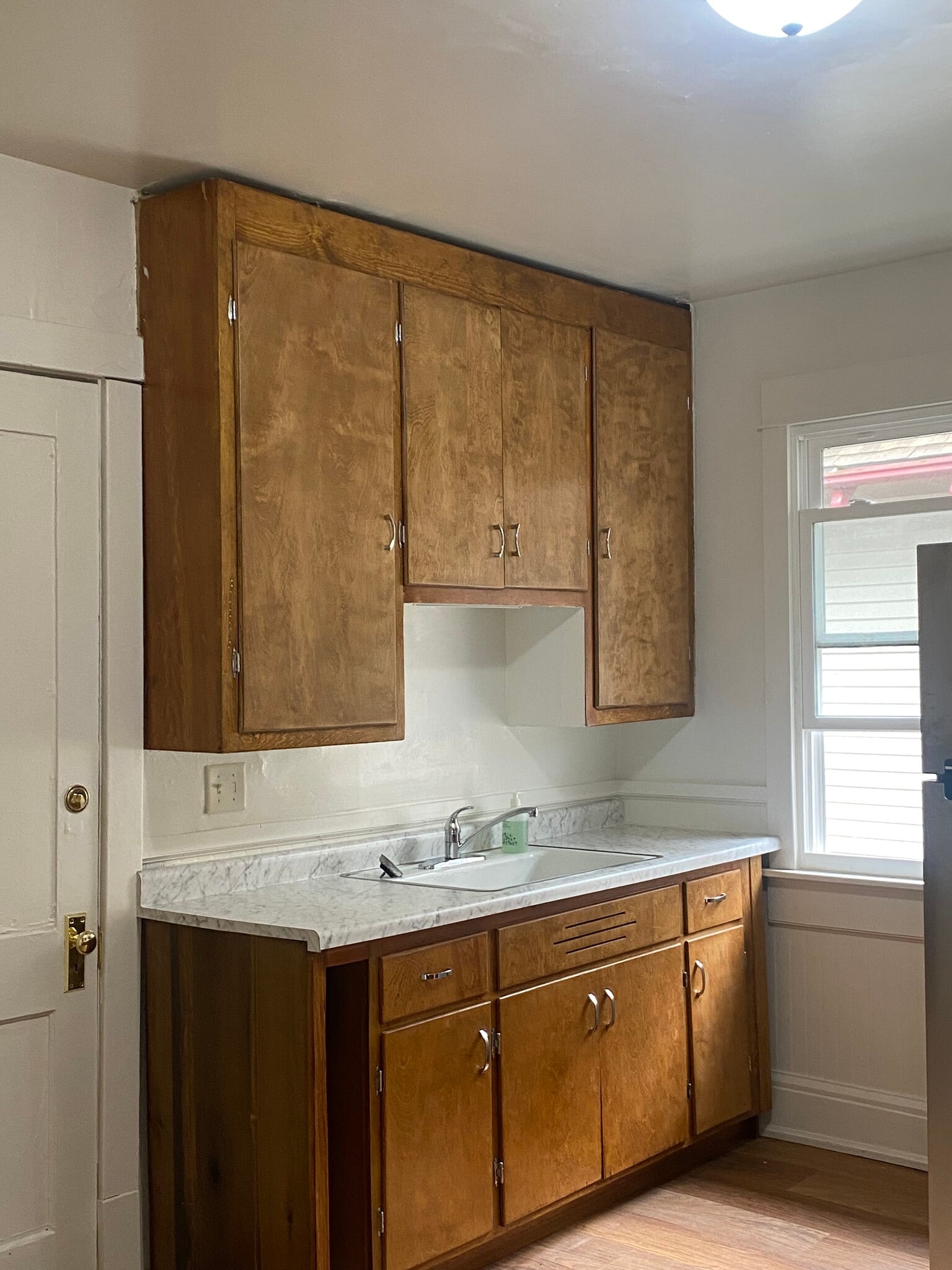 completely remodeled kitchen with original restored cabinets - 2550 N 45th St
