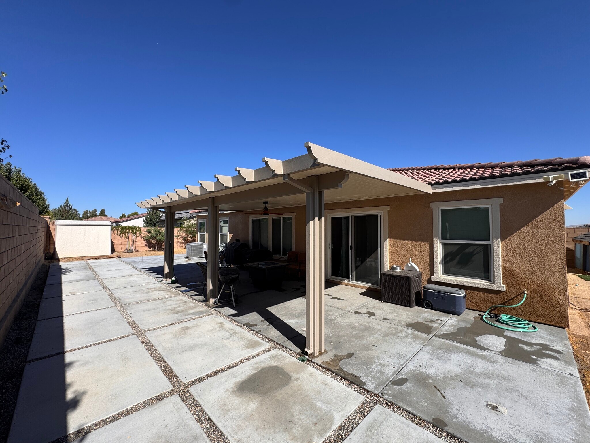 Concrete back yard with aluminum patio - 15659 Whispering Creek Way