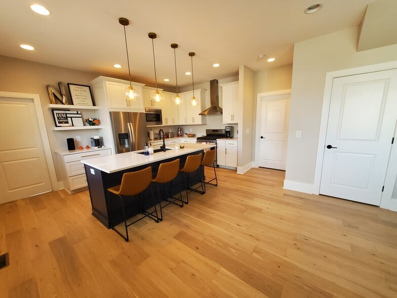Kitchen features a large island with ample seating and storage. - 1021 Cheatham Pl