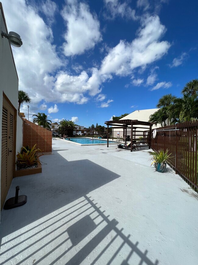 Pool view with cabanas - 1424 SW 131st Place Cir E