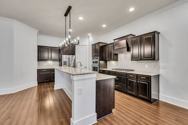 Building Photo - Beautifully maintained and move-in ready, this stunning mostly one-level all-brick home