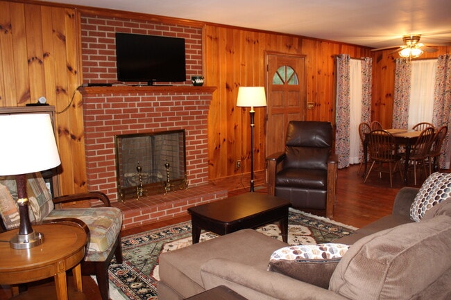 Living Room into dining area. Note fireplace is not in working order. - 133 Rockdale Ave