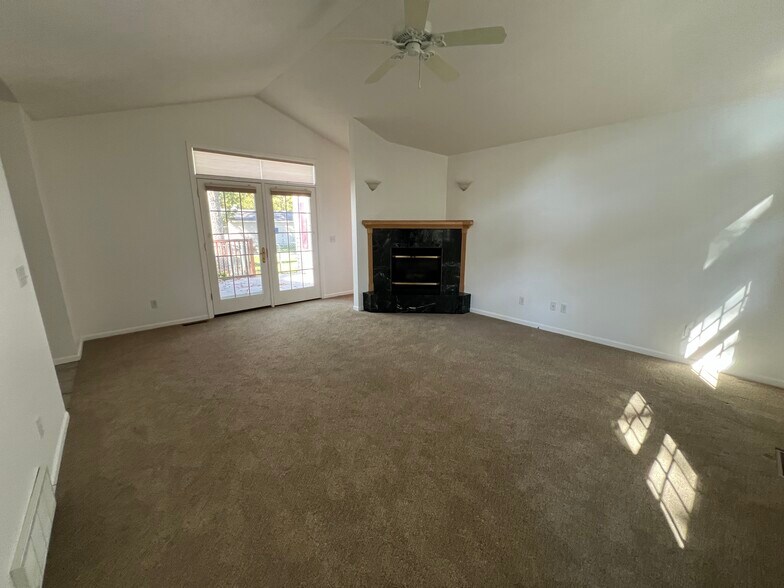 Living room with gas fireplace - 214 W Sixteenth St