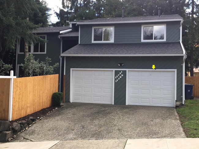 Two Car Parking: 1 Garage (on the right with yellow arrow) + 1 parking in Driveway - 17731 NE 88th Pl