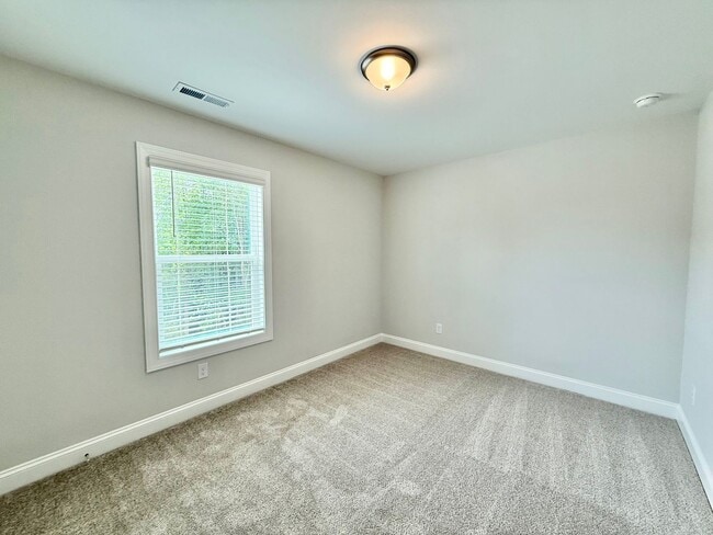Building Photo - Stunning End Unit New Construction 3BD, 3....